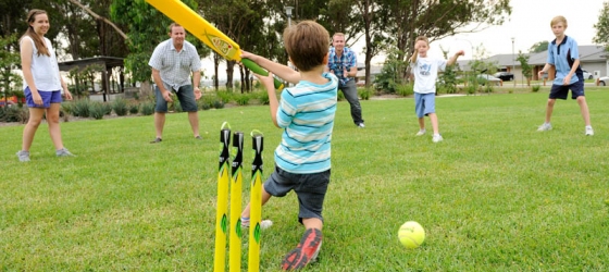 Gregory Hills Playing Criket Outside Sport Fields